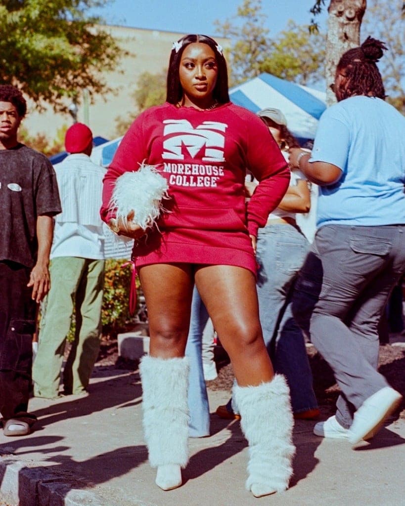 Woman in a Morehouse COLLEGE sweatshirt dress at homecoming